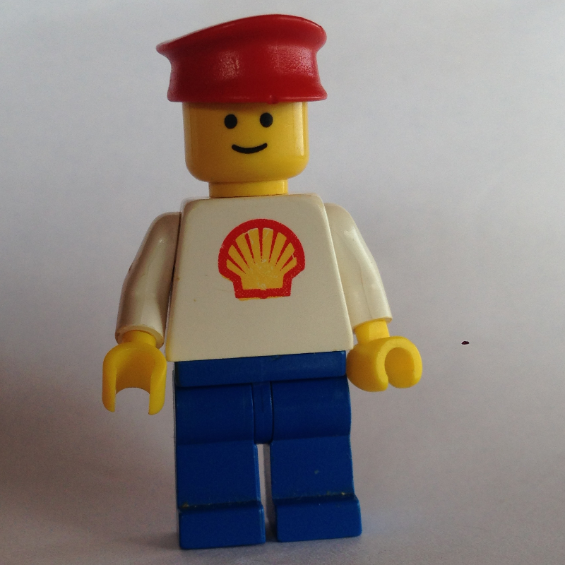 Lego Man, White Torso with Shell Logo, Blue Legs, Red Hat