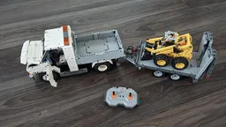 VW T6.1 Pritsche Doka mit Anhänger und Cat Mini Radlader, Baustelle