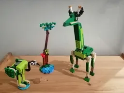 Giraffe, flamingo and tree