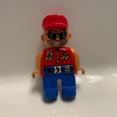 Lego Duplo Figure, Early, Cap Red, Blue Legs, Shirt with Pockets and Wrench, Belt with Silver Buckle, Sunglasses and Beard Print / Red