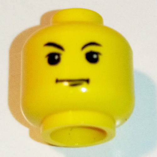 Lego Minifig Head Tom Riddle (Voldemort), White Pupils, Arched Right Brow, Chin Dimple Print [Blocked Open Stud] / Yellow