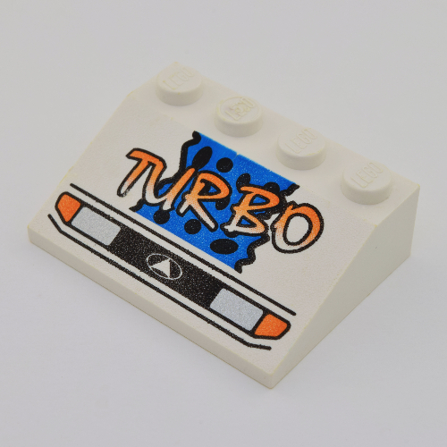 Lego Brick Sloped 33° 3 x 4 with Headlights, Yellow 'TURBO', Blue Background and Black Spots Print / White
