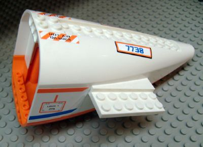 Lego Aircraft Fuselage Aft Section Curved with Fixed Orange Base and White Hard Rubber Tip with Orange and Blue Stripes, 'HOT AIR DANGER', and '7738', Access Panel Pattern on Both Sides (Stickers) - Set 7738