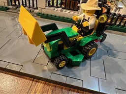 John Deere 1025R tractor with backhoe