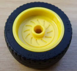 Wheel 18mm D. x 12mm with Axle Hole and Stud with Black Tire 24 x 12 Low (18976 / 18977) / Yellow