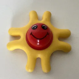 Primo Teether, 8 Arms, with Red Center and Smiling Face Print / Yellow