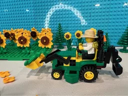 John Deere 1025R tractor with backhoe