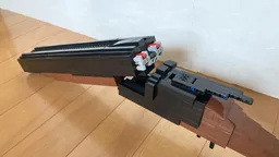 Double barrel shotgun brick shooting and shell ejecting