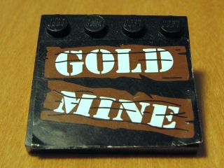 Lego Tile, Modified 4 x 4 with Studs on Edge with White 'GOLD MINE' on Brown Boards Pattern (Sticker) - Set 6761