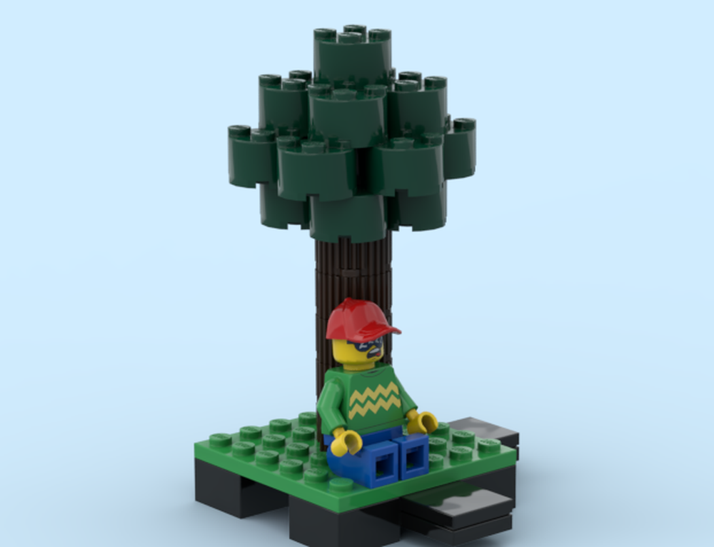 Lego sleeping guy next a tree