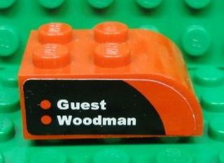 Lego Slope, Curved 3 x 2 with 4 Studs with 'Guest' and 'Woodman' on Black and Red Background Pattern Model Left Side (Sticker) - Set 8655