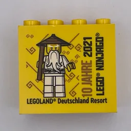 Brick 2 x 4 x 3 with 'LEGOLAND Deutschland Resort' and '10 JAHRE 2021 LEGO NINJAGO' Print / Yellow