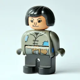Duplo Figure, Early, Hair Bob Black, Black Legs, Tunic with Blue Patches and Rope Belt, Wart on Nose (Actress) / Dark Gray