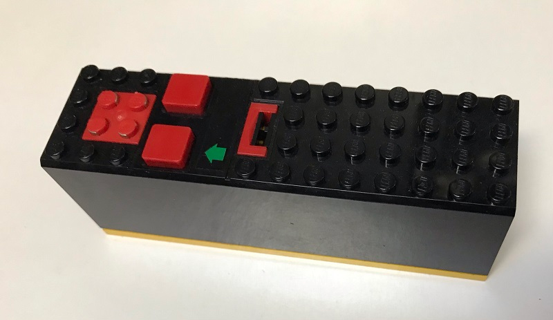 Lego Electric 9V Battery Box 4 x 14 x 4 with Red Buttons and Contact Plate with Yellow Base with Green Arrow Pattern (Sticker) - Set 8082