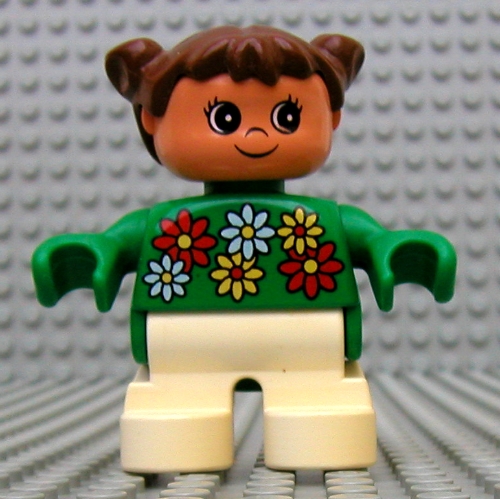 Lego Duplo Figure, Early Child, with Pigtails Brown, White Legs, White, Red and Yellow Flowers / Green