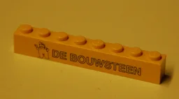 Brick 1 x 8 with Black 'DE BOUWSTEEN' and Waving Figure Pattern