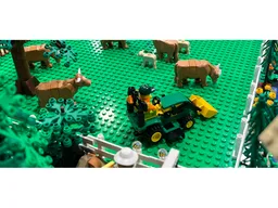 John Deere 1025R tractor with backhoe