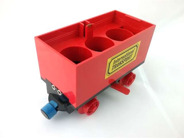 Lego Train Battery Box Car with Two Contact Holes, Red Switch Lever, Blue and Red Magnets, and Red Wheels with 'International TRANSPORT' Pattern on Both Sides (Stickers) - Sets 161 / 181-1 / 183