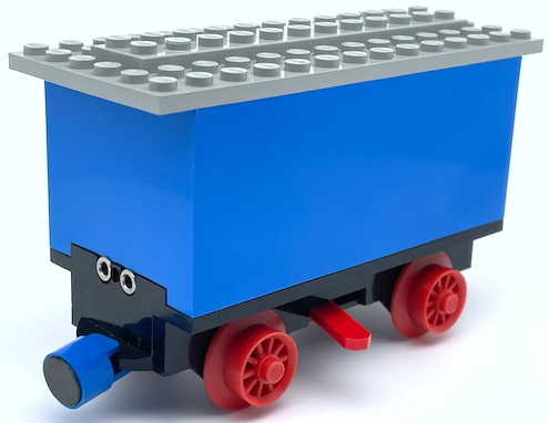 Lego Train Battery Box Car with Three Contact Holes, Red Switch Lever, Blue and Red Magnets, Red Wheels, and Light Gray Roof