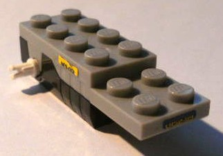 Lego Pullback Motor 6 x 2 x 1 1/3 with Black Base and White Wheels Holder Pins (Motor 1) with 'LR52-89' on Front / Back, 'NES-001' on Sides Pattern (Stickers) - Set 4299