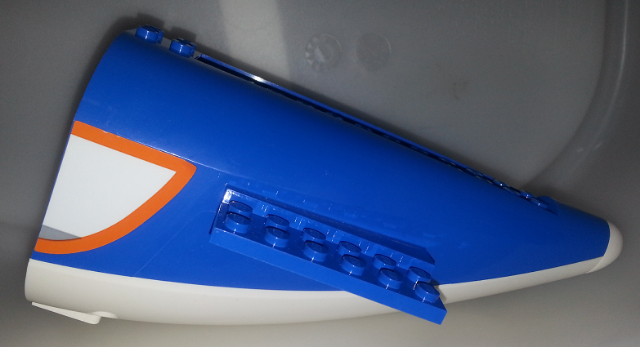 Lego Aircraft Fuselage Aft Section Curved with Fixed White Base and White Hard Rubber Tip with Orange, Light Bluish Gray, and White Panel Pattern on Both Sides (Stickers) - Set 60104