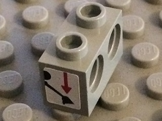 Lego Technic, Brick 1 x 2 with Holes with Black Digger Bucket and Red Arrow Down on White Background Pattern (Sticker) - Set 8459