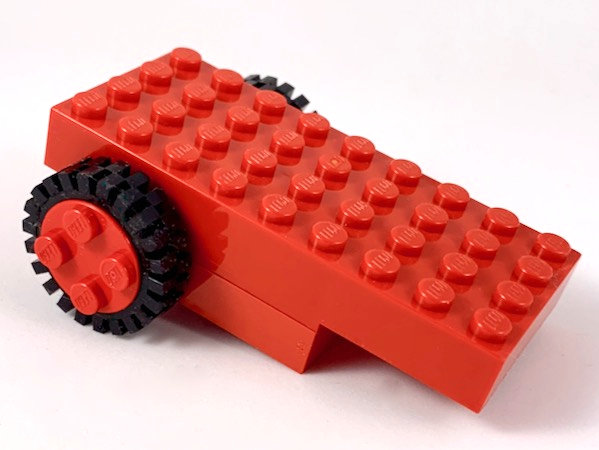 Lego Pullback Motor 9 x 4 with 2 Black Tire 24mm D. x 8mm Offset Tread - Interior Ridges (2574 / 3483)