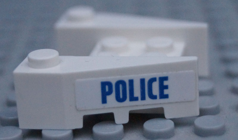 Lego Wedge 3 1/2 x 4 with Stud Notches with Blue 'POLICE' Pattern on Both Sides (Stickers) - Set 60131