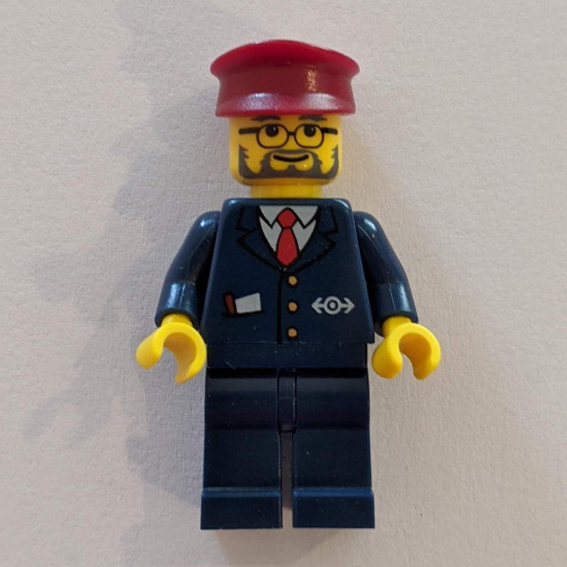 Lego Conductor - Dark Blue Jacket, Dark Blue Legs, Dark Red Hat, Glasses, Beard