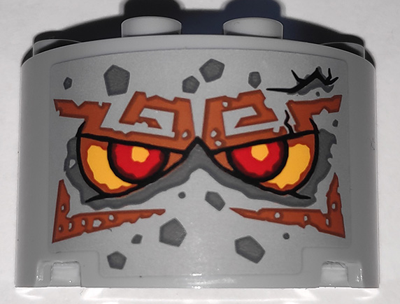 Lego Cylinder Half 2 x 4 x 2 with 1 x 2 Cutout with Stone Face with Red Eyes and Dark Orange Eyebrows Pattern (Sticker) - Set 71747
