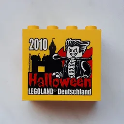 Brick 2 x 4 x 3 with 'LEGOLAND Deutschland Halloween 2010' Print / Yellow