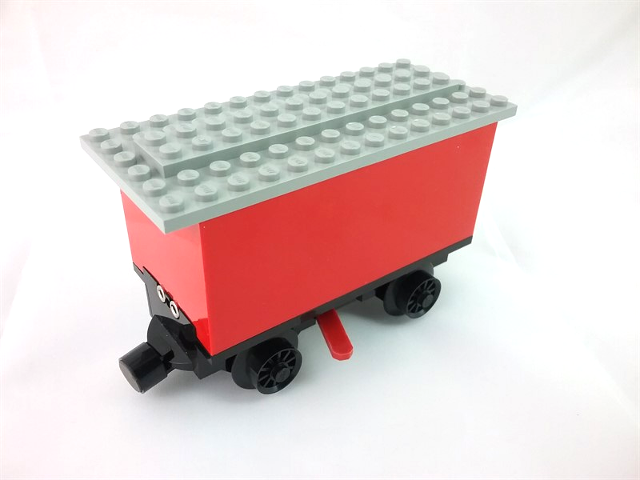 Lego Train Battery Box Car with Three Contact Holes, Red Switch Lever, Black Magnets, Black Wheels, and Light Gray Roof