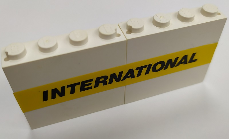 Lego Stickered Assembly 8 x 1 x 3 with Black 'INTERNATIONAL' on Yellow Stripe Pattern (Sticker) - Set 6367