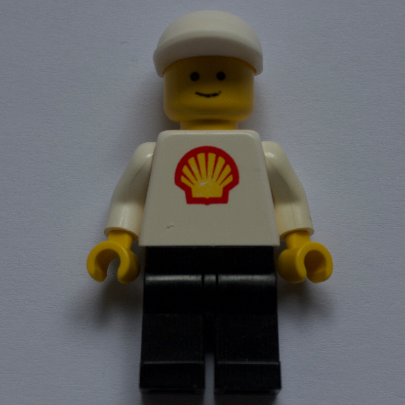 Lego Man, White Torso with Shell Logo, Black Legs, White Cap