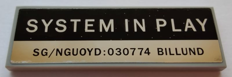 Lego Tile 2 x 6 with 'SYSTEM IN PLAY' and 'SG/NGUOYD:030774 BILLUND' Pattern (Sticker) - Set 21327
