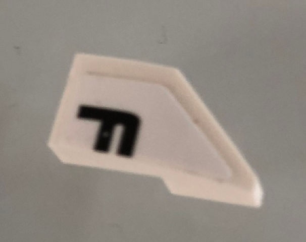 Lego Wedge 2 x 1 x 2/3 Left with Black Letter F on White Background Pattern (Sticker) - Set 42096