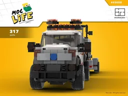 Ford F-450 quad cab long bed with little road roller
