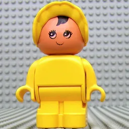 Duplo Figure, Early with Joined Legs, with Yellow Legs, Black Hair, and Yellow Bonnet (Baby) / Yellow