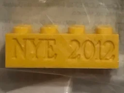 Brick 2 x 4 with Engraved NYE 2012 Pattern