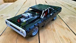 Fully RC with 4-speed motorized gearbox Lego Technic Dom's Dodge Charger model 42111 with lights and some changes.