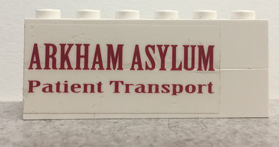 Lego Stickered Assembly 6 x 1 x 2 with 'ARKHAM ASYLUM Patient Transport' Pattern Model Right Side (Sticker) - Set 7785