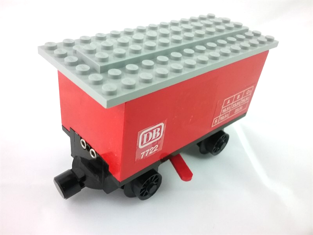 Lego Train Battery Box Car with Three Contact Holes, Red Switch Lever, Black Magnets, Black Wheels, and Light Gray Roof with 'DB 7722' Pattern on Both Sides (Stickers) - Set 7722