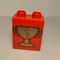 Duplo Brick 1 x 2 x 2 with Trophy Cup Number 1, Dark Gold Print / Red