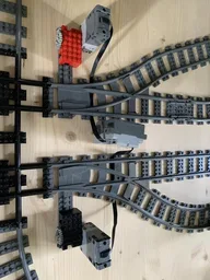 Motorized train track switch