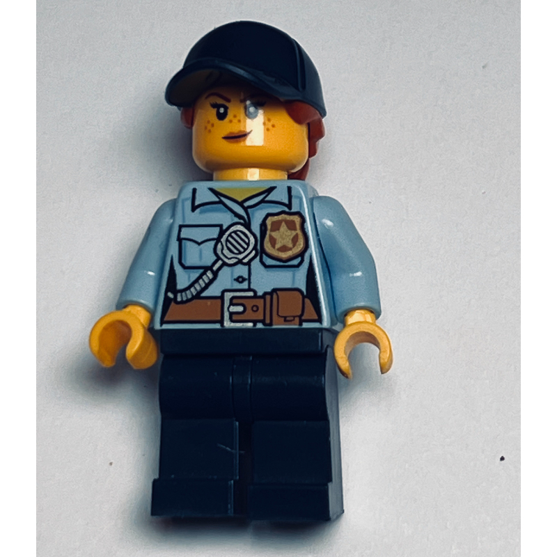 Lego Policewoman, Bright Light Blue Shirt with Radio and Badge, Dark Blue Legs, Dark Blue Cap with Hair, Freckles
