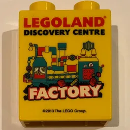 Duplo Brick 1 x 2 x 2 with 'LEGOLAND DISCOVERY CENTRE FACTORY' Print - 2013 / Yellow