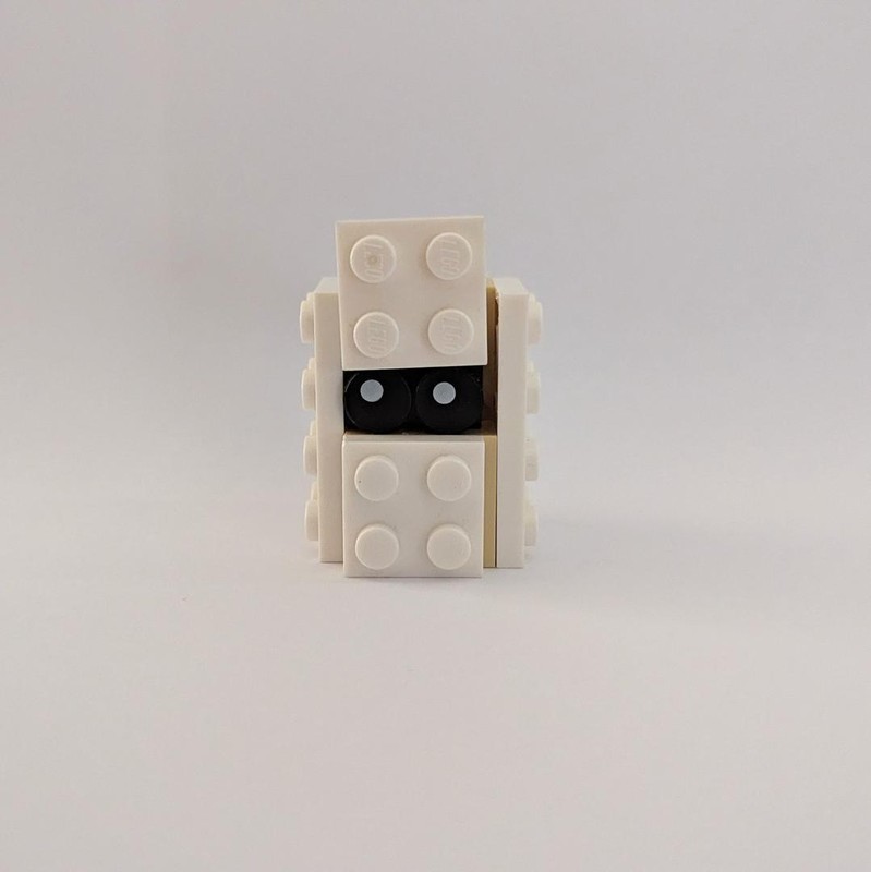 Lego Animal in a snowy log