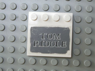 Lego Tile, Modified 4 x 4 with Studs on Edge with 'TOM RIDDLE' on Dark Bluish Gray Background Pattern (Sticker) - Set 4766