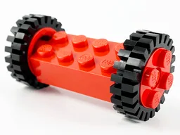 Brick, Modified 2 x 4 with Pins with 2 Red Wheel FreeStyle with Technic Pin Hole and 2 Black Tire 24mm D. x 8mm Offset Tread (6249 / 6248 / 3483)