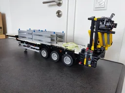Flatbed trailer with crane